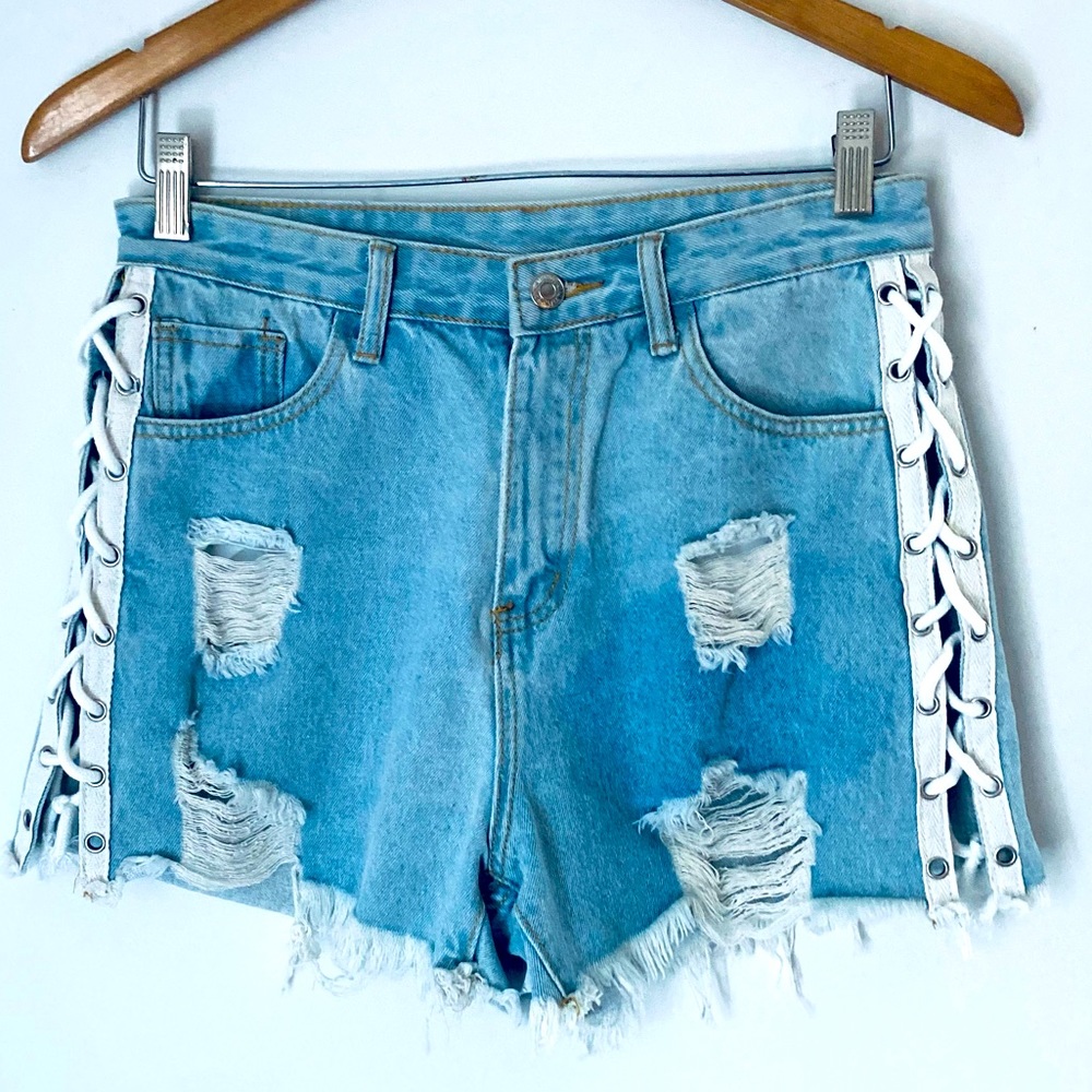 Levis denim distressed shorts with ties. Size Medium